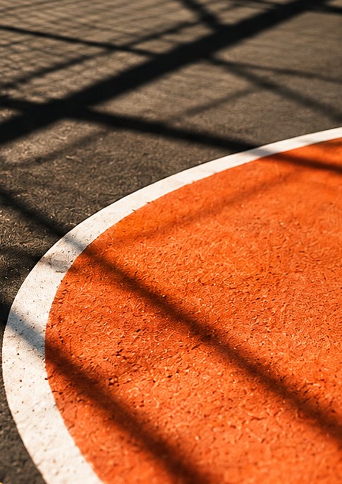 Orange sports court with net shadows — TownCup brand imagery
